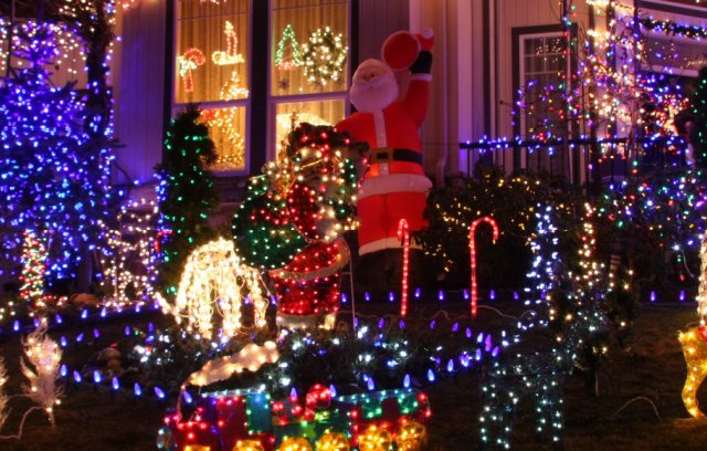 House decorated with Christmas themes and lights in garden