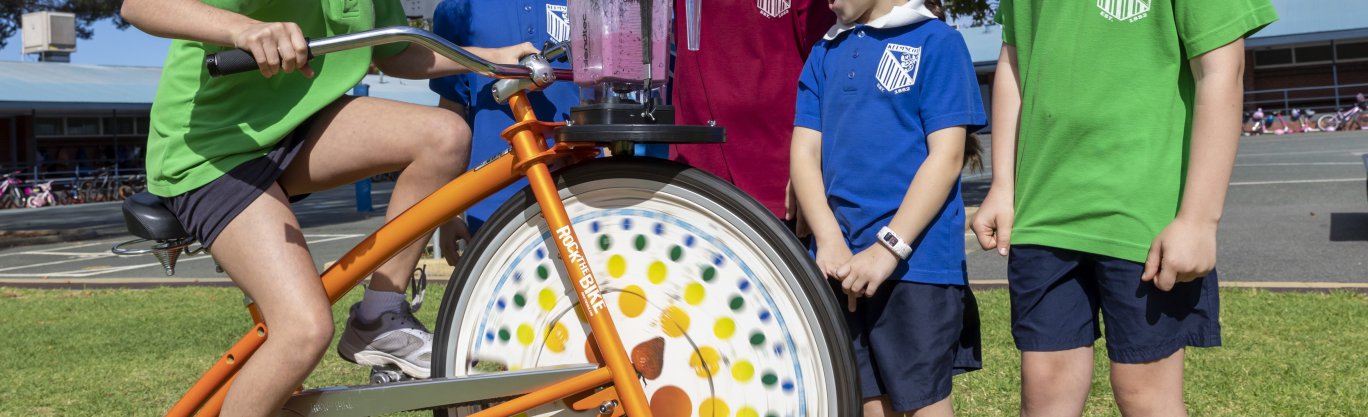 Children riding blender bike, blending a smoothie